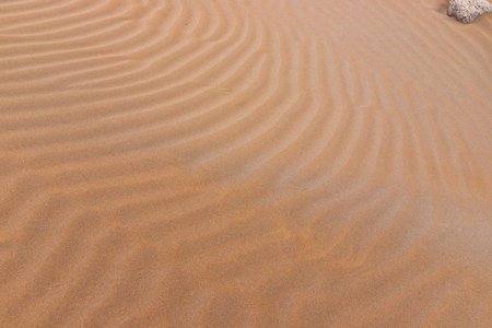 Beautiful wavy sand texture on the beach. Caspian Sea. Azerbaijan.