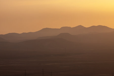 Mountain ridges with steps at sunset. Gobustan. Azerbaijan.の写真素材