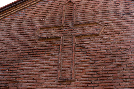 City of Gakh. Azerbaijan. 11.24.2022. Christian cross on the wall of the temple in the city of Gakh. Kurmuk Temple 7th century.のeditorial素材
