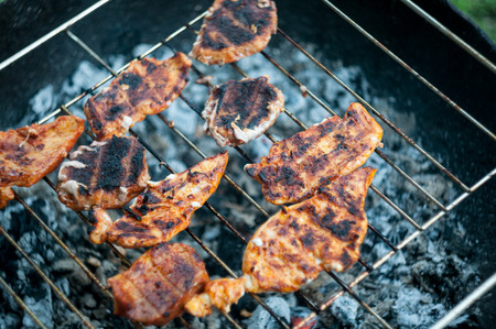 burned meat on the grill, bbq