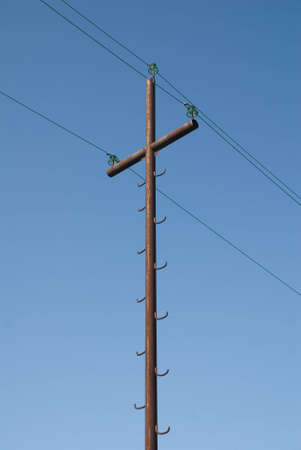 High-voltage post on a background blue skyの写真素材