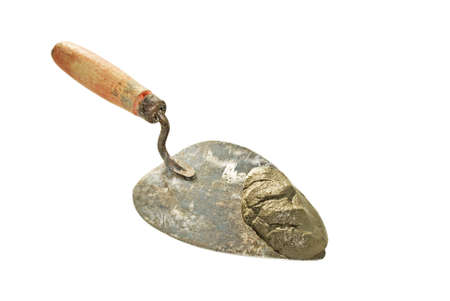 Trowel with cement on a white backgroundの写真素材