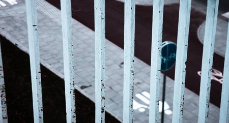 Fence bars above pedestrian/bike street