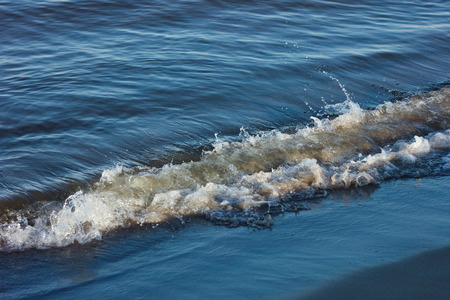 sea wave after crashing hard