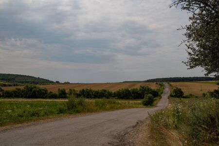 field road between hillsの写真素材