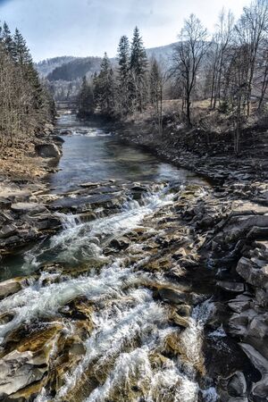 fast mountain river in early springの写真素材