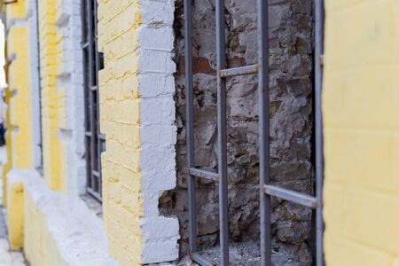 iron fence on windows during renovation of buildingの写真素材