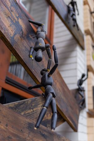 black wooden dummies for drawing in different poses on windowsの写真素材