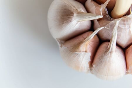 garlic close-up macro isolated on white backgroundの写真素材