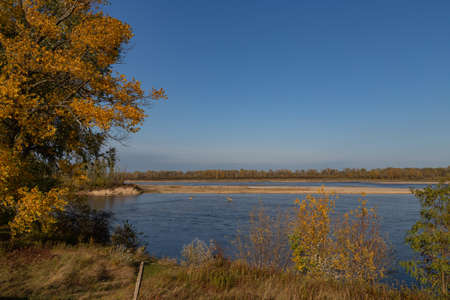 view of the Vistula river with blue water on a background of blue sky in autumnの写真素材