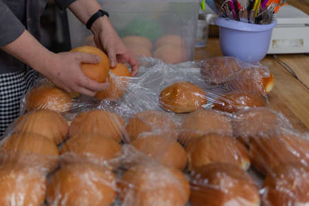 fragrant hamburger buns the chef takes out of polyethylene