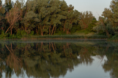 Beautiful landscape with a lake at sunrise in the morningの写真素材