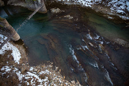 mountain river with clear water in the Carpathian mountains in Yaremche in winter Ukraineの写真素材