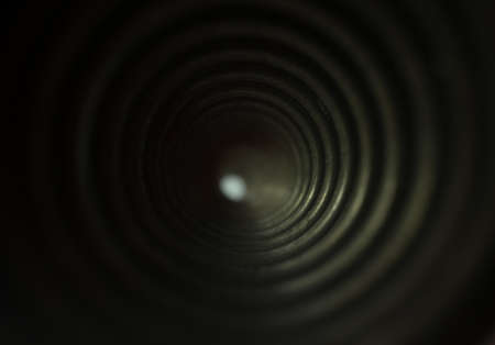 view through steel spring photographed in close-up perspective in daylight spring is new and has scratchesの写真素材