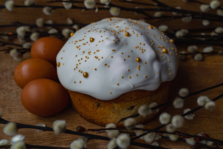 Easter cake with white frosting, eggs and willow branchesの写真素材
