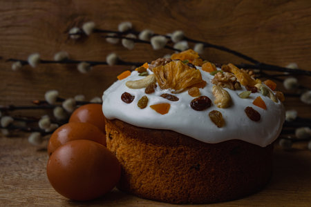 Easter cake with nuts and raisins on a wooden backgroundの写真素材