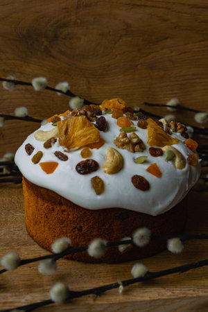 Easter cake with nuts and raisins on a wooden backgroundの写真素材