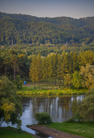 Sunset over the river in the forest Plotsk Poland. Beautiful summer landscape.の写真素材