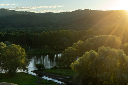 Sunset over the river in the forest Plotsk Poland. Beautiful summer landscape.の写真素材