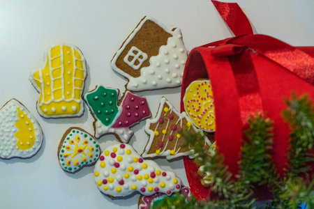 Gingerbread cookies in a red box on the background of a Christmas treeの写真素材