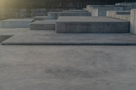 concrete stairs in the park with sun light. perspective view.