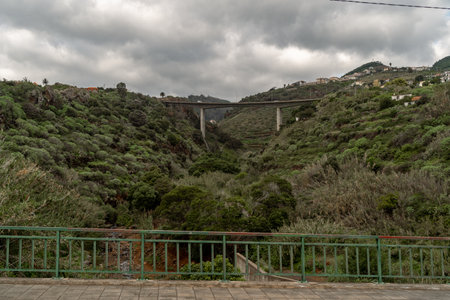 bridge over the river in the mountainsの写真素材