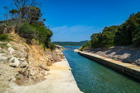 Boat dock in the sea on the island of Corfu, Greeceの写真素材