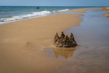 sand castle on the beach in the summer, photo as a background, digital imageの写真素材