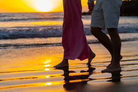 Couple in love walking on the beach at sunset. Love conceptの写真素材