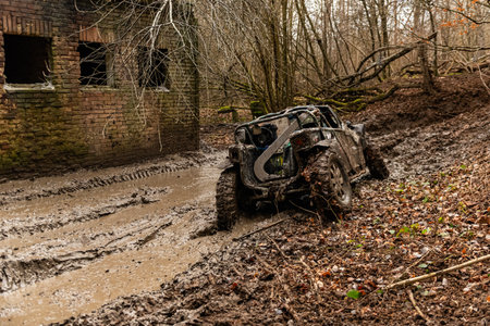 Off-road vehicle on a muddy road in the countryside. Landscape.の写真素材