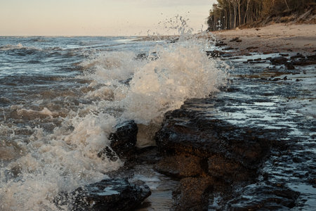 Waves breaking on the rocks on the Baltic Sea coast in Poland.の写真素材