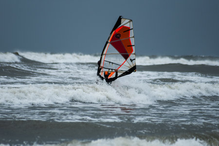 Windsurfers on the Baltic Sea in stormy weather in Ustka, Polandの写真素材
