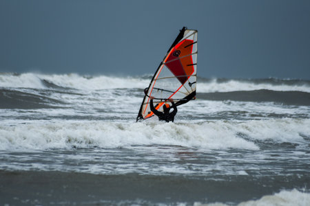 Windsurfers on the Baltic Sea in stormy weather in Ustka, Polandの写真素材