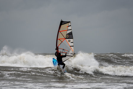 Windsurfers on the Baltic Sea in stormy weather in Ustka, Polandの写真素材