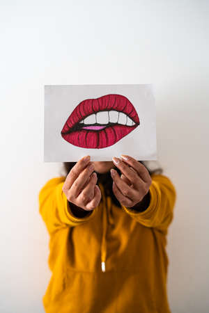 Girl with her lips drawingの写真素材