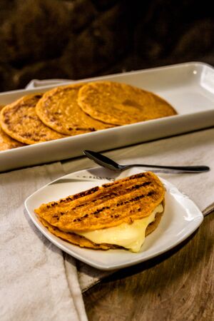 Typical colombian food "arepa choclo" Colombian cuisine made of ground corn and white cheese, another version of the Cachapa with cheese, Typical Venezuelan cuisineの写真素材