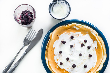 Pancakes with blueberries and sweet creamの写真素材