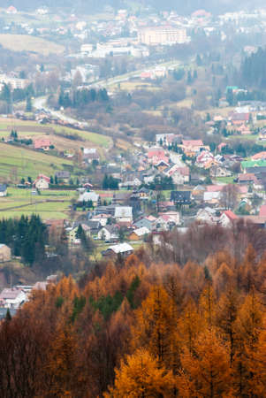 View from the hill on the city on an autumn day, Beskids, Polandの写真素材
