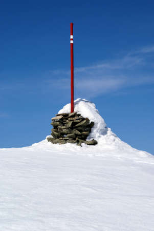 Wooden signpost in the mountains in winter scenery, Beskids, Polandの写真素材