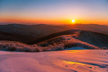 Mountain peaks in the setting sun on a winter day, Bieszczady Mountains, Polandの写真素材