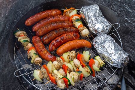 Summer Grill. Grilled sausage and skewers.の写真素材