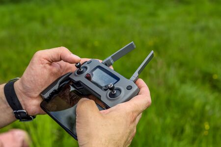Drone controller, on a background of grass.の写真素材