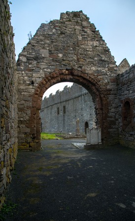 Ardfert Cathedral ruins in Ireland with blue skyの写真素材