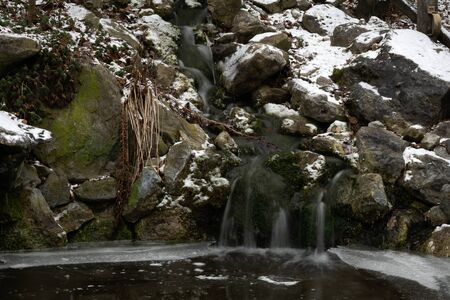 Tiny pond in winter with time exposureの写真素材