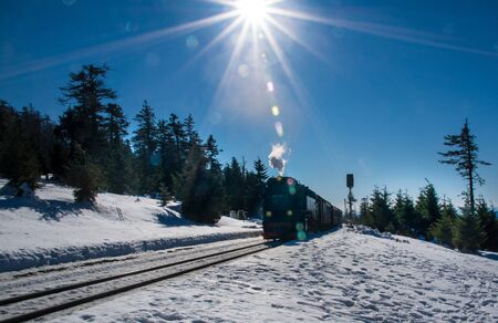Steam engined train at the in the german region called Harz in wintertimeの写真素材