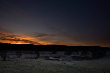 Sunset with colored sky at the german Rothaargebirgeの写真素材