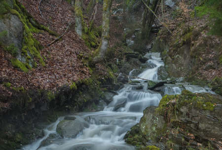 Time exposure of the little river called Helle in the german city Winterberg