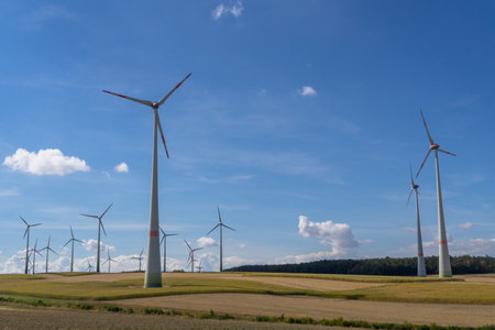 View to many windmills to generate electricity with blue cloudy sky