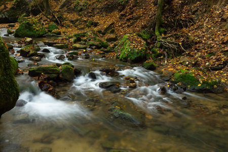 Tiny river called Schwarze Ernz near the waterfall Schiessentuempel in Luxembourg
