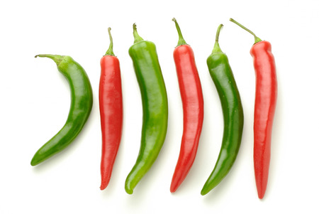 green and red peppers on white backgroundの写真素材